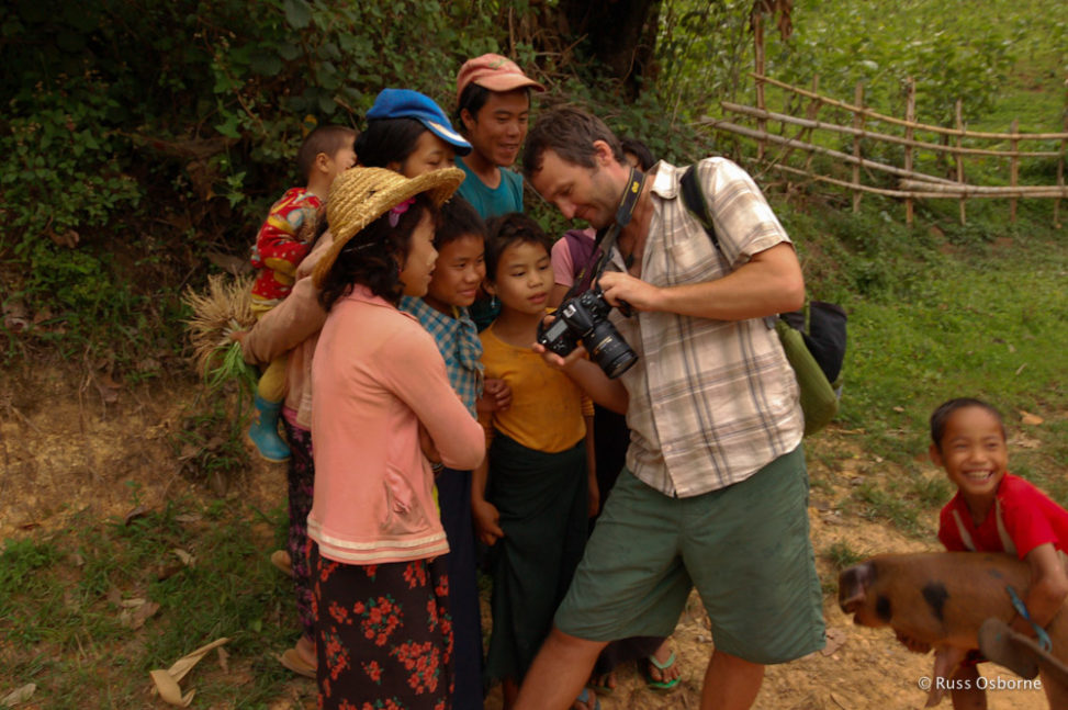 Showing some locals a photo I took of them.