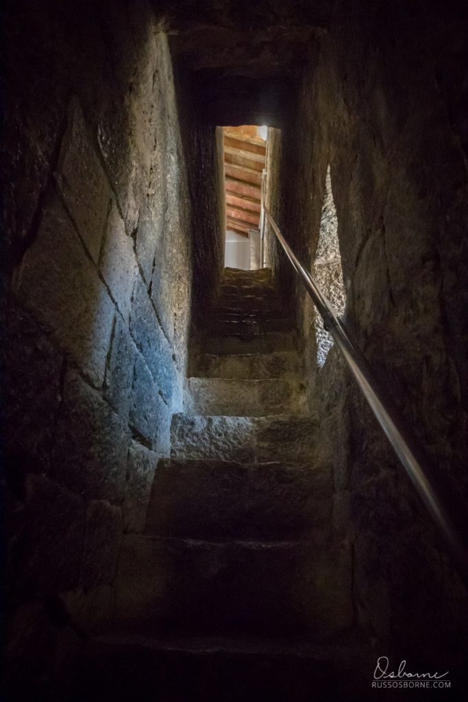 Steep, narrow stairwell to rooftop patio